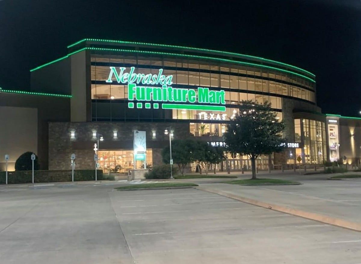 The nebraska furniture mall is lit up at night