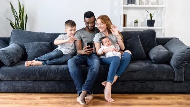 Photo of multi-racial family on sofa