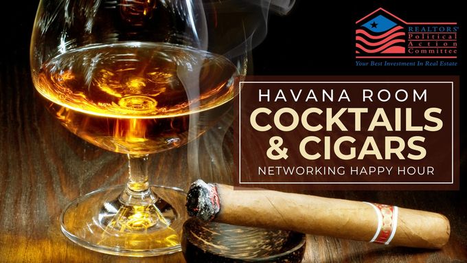 A glass of liquor and a lit cigar with a sign advertising Havana Room Cocktails & Cigars Networking Happy Hour. 