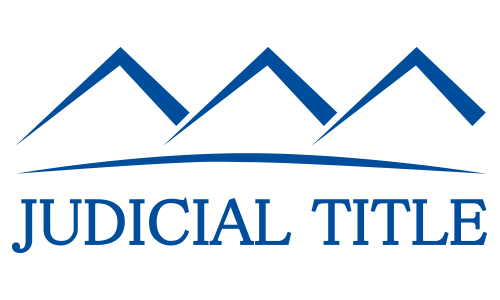 Judicial Title logo with blue mountain peaks and curved line above the company name.