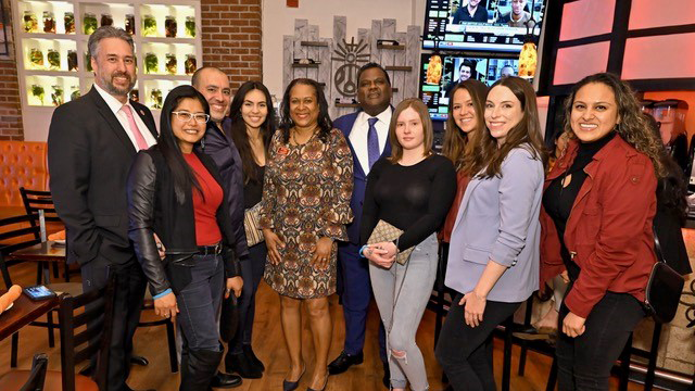 A group of people at a YPN event at a restaurant.