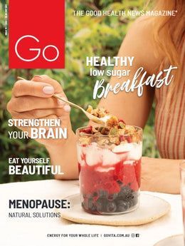 A woman is eating a healthy low sugar breakfast on the cover of a magazine.