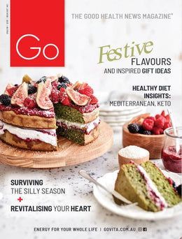 The cover of the good health news magazine with a cake on it.