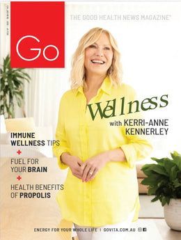 A woman in a yellow shirt is on the cover of a magazine.