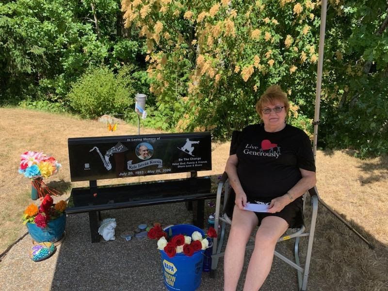 Kyle Kocsis's Grandmother sitting by his bench in Bayview Cemetery Bellingham WA