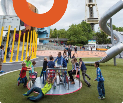 Photo of children playing at the Artists at Play Playground.