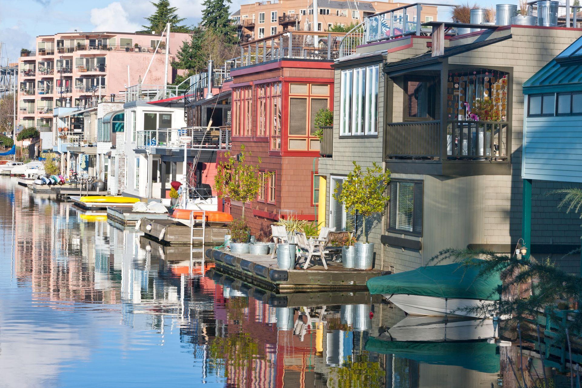 A row of houses sitting on top of a body of water.