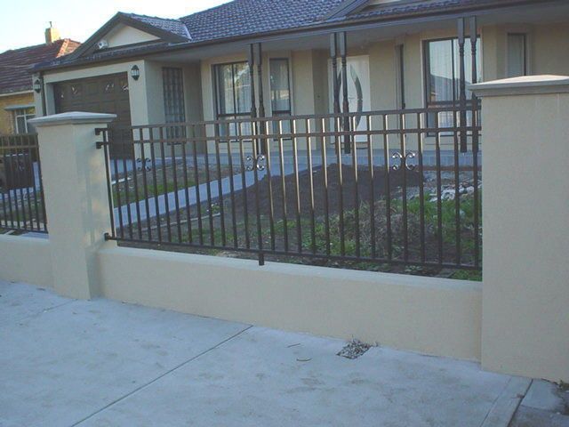 A house with a fence in front of it