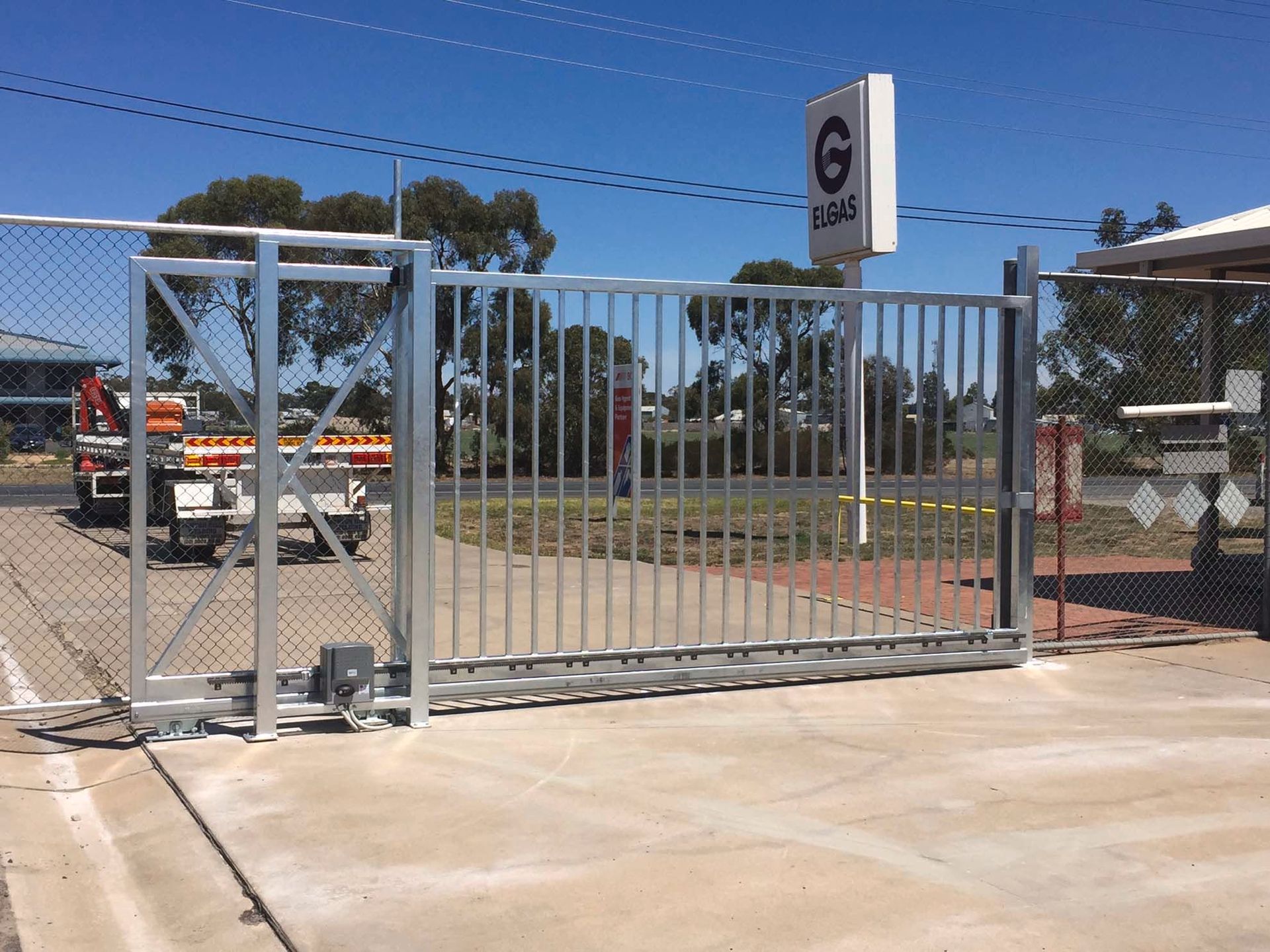 A sliding gate with a sign that says g on it
