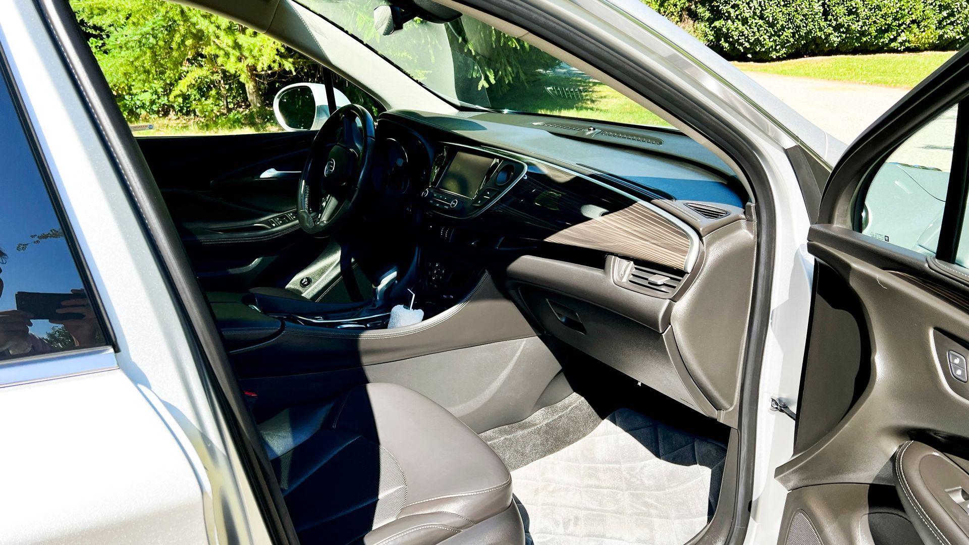 Interior Detailing - The inside of a white car with the door open.