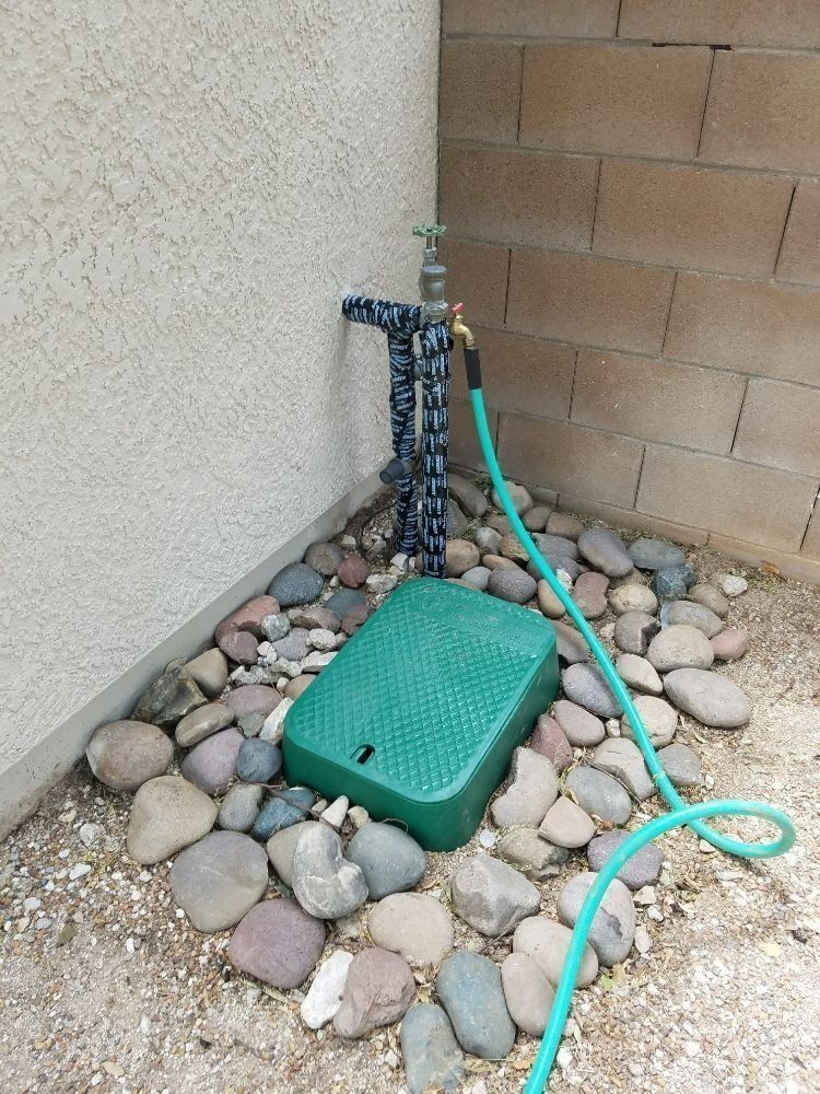 Black Jeep SUV with extensive hail damage on hood and windshield.