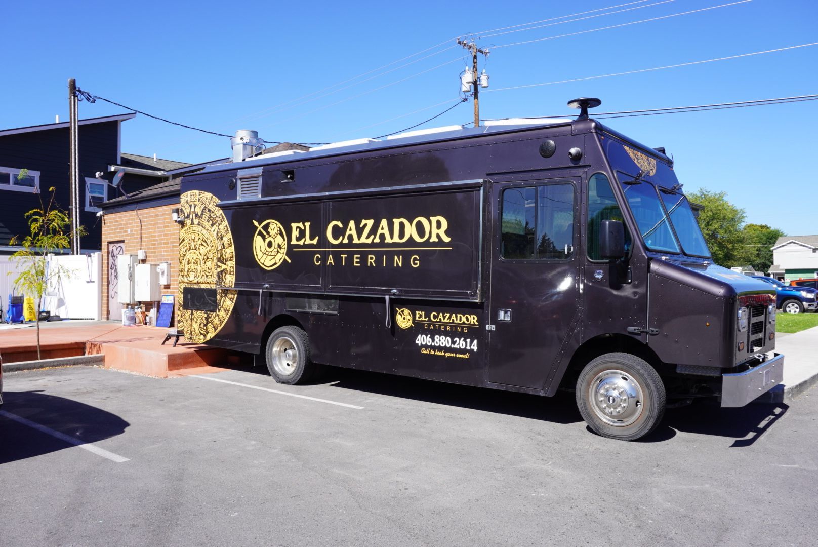 A man is cooking on a stove that says imperial