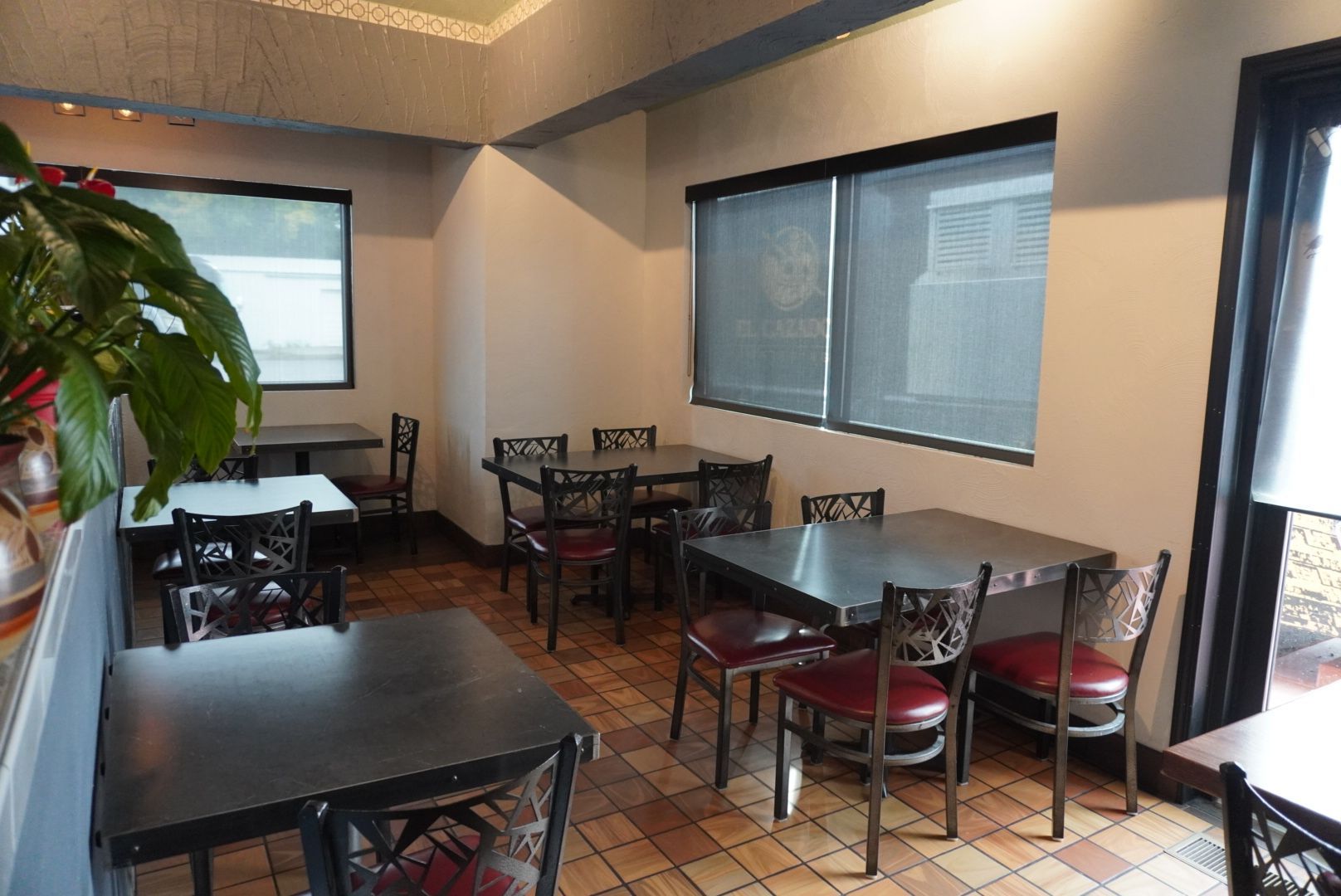 A black el cazador catering truck is parked in the snow