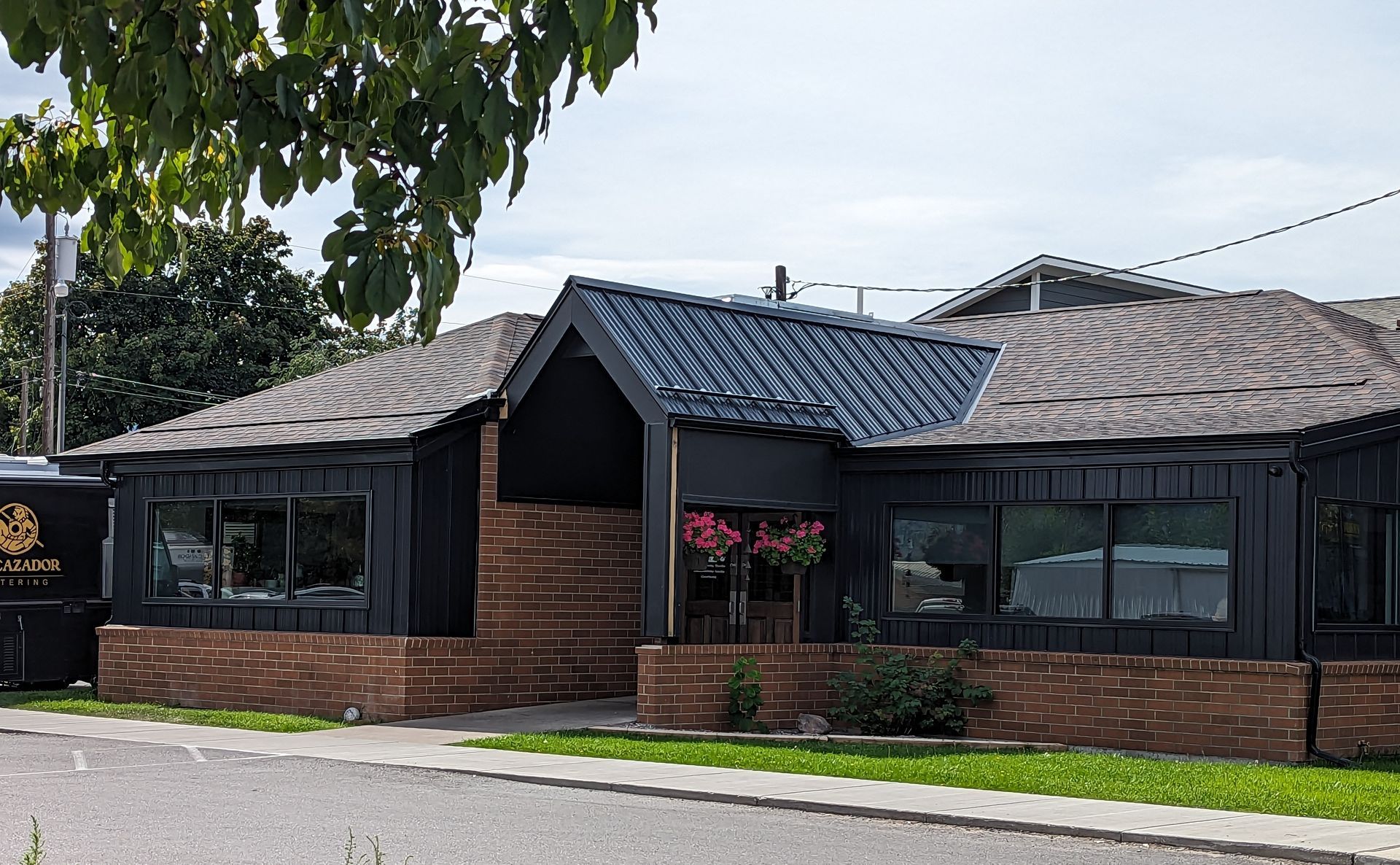 A restaurant with tables and chairs and a clock on the wall.