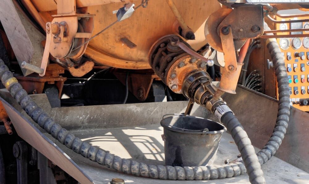A Plumber is Working on a Boiler With a Screwdriver — Precise Plumbing & Excavations Pty Ltd in Bowen, QLD
