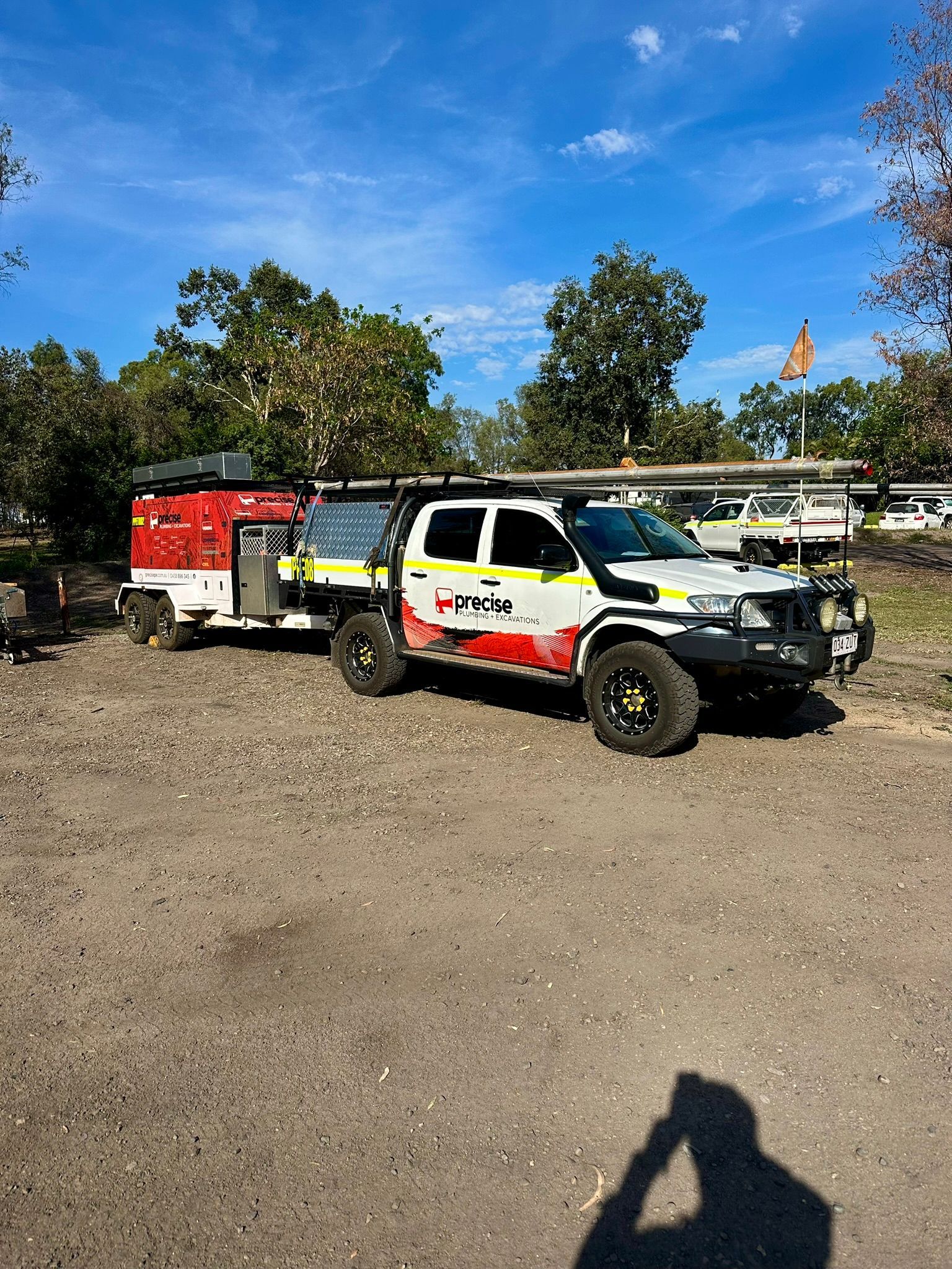 A Person Wearing Blue Gloves is Cleaning a Sink With a Hose — Precise Plumbing & Excavations Pty Ltd in Airlie Beach, QLD