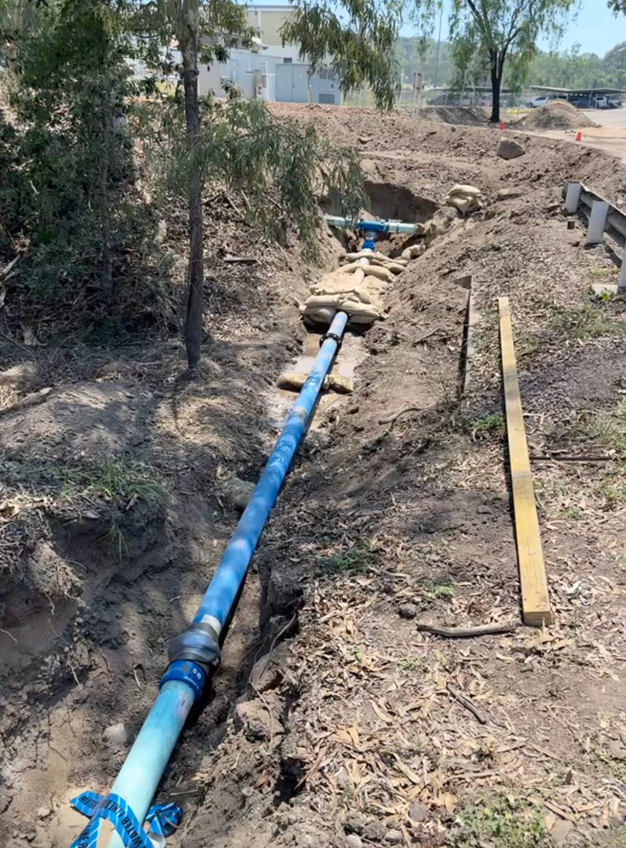 A Plumber is Fixing a Sink With a Wrench — Precise Plumbing & Excavations Pty Ltd in Bowen, QLD