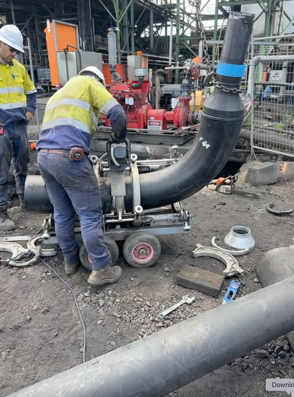 A Plumber is Working on a Pipe With a Pair of Pliers — Precise Plumbing & Excavations Pty Ltd in Bowen, QLD