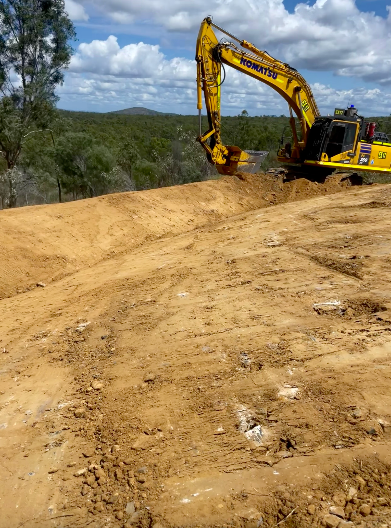 A Spool of Wires is Sitting in the Dirt on a Construction Site — Precise Plumbing & Excavations Pty Ltd in Bowen, QLD