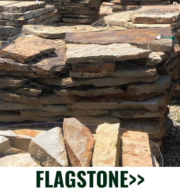 Stacked tan and brown flagstone slabs with the label “FLAGSTONE” at the bottom.