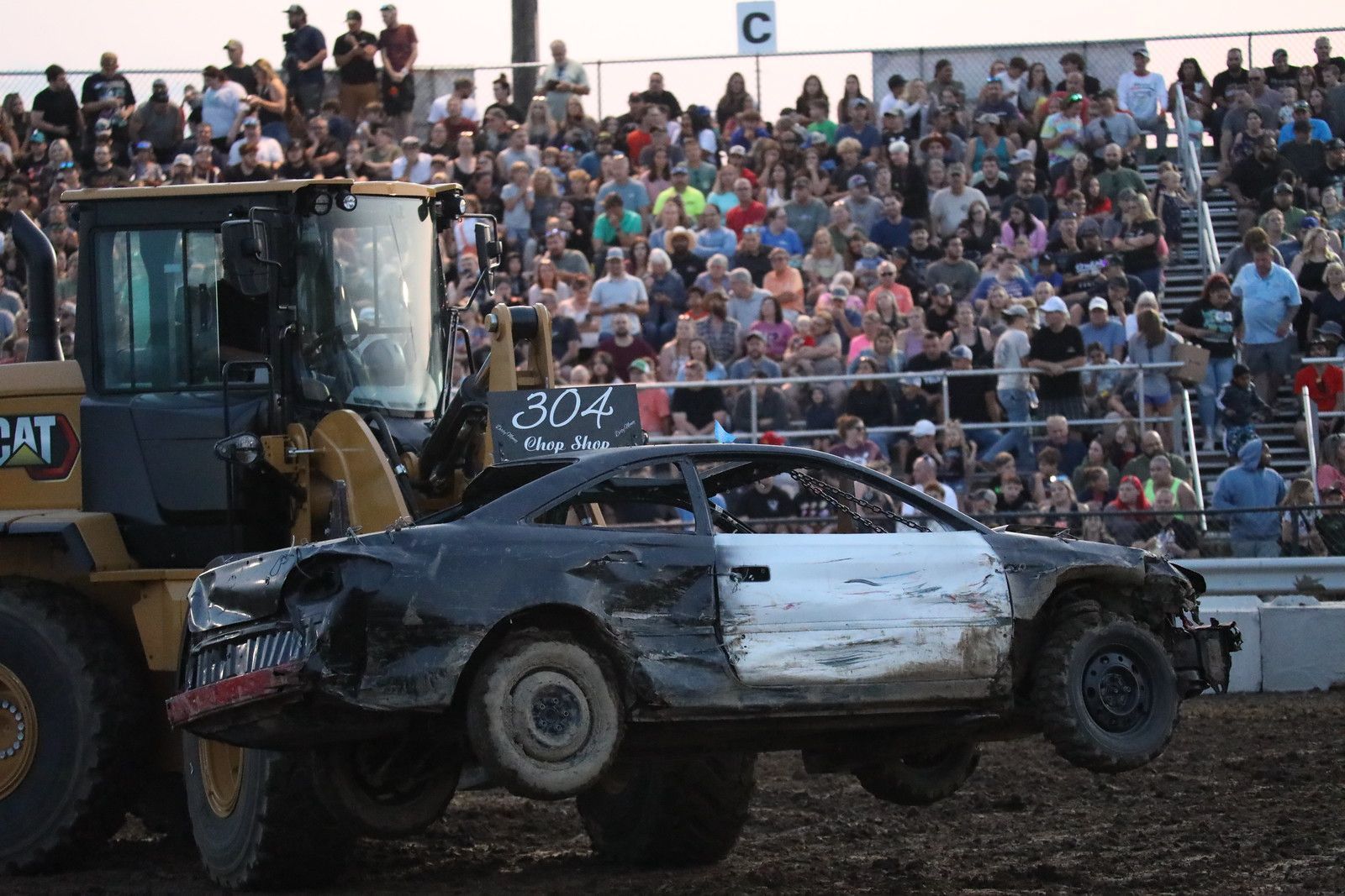 Logo for 'Grandstand Shows' podcast. White text on brown background with two ticket illustrations.