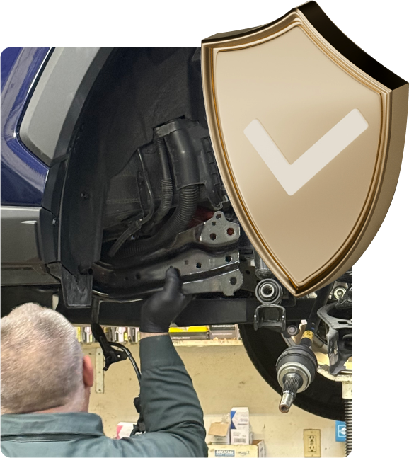 Expert Staff at work on vehicle | Greentree Tire & Auto