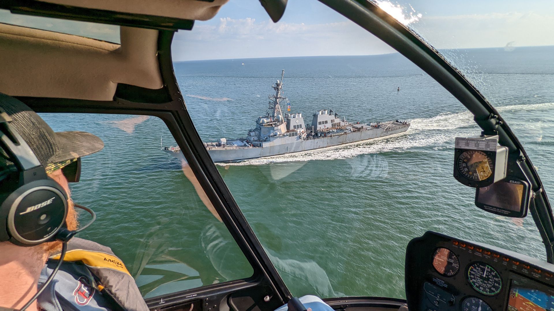 A US Navy destroyer photographed from an R-44
