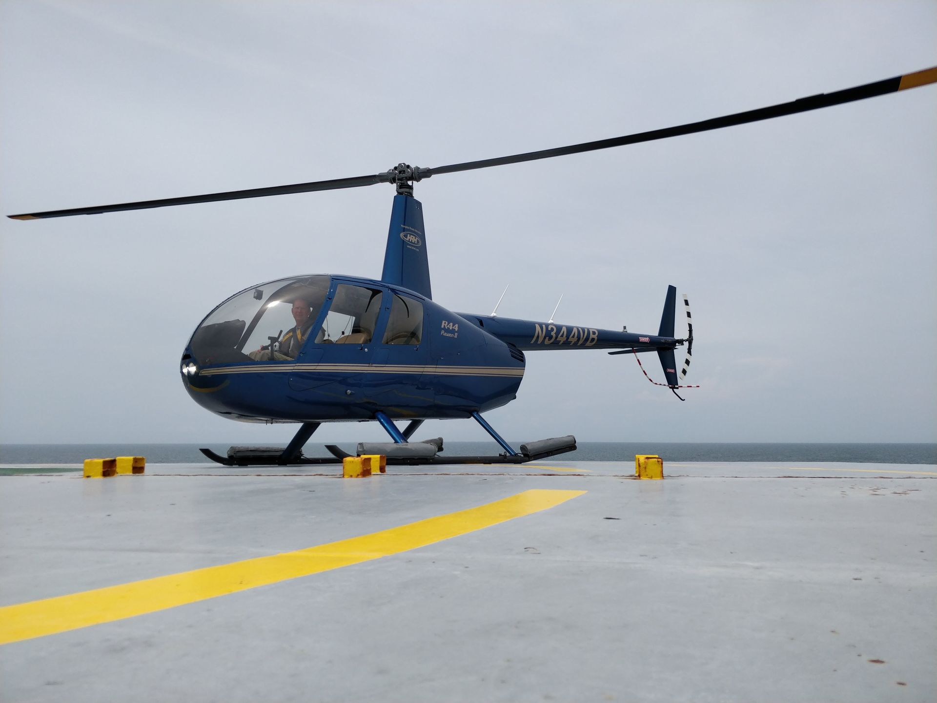 An R-44 landed on the deck of a ship.