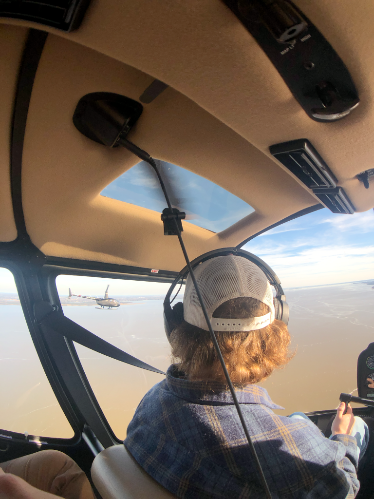 Two R-44s formation flying down the James River