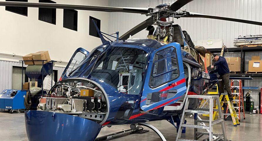 Helicopter being repaired