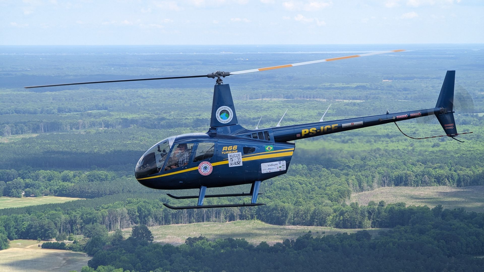 The R-66 that Peter Wilson and Andre de Freitas flew around the world as it passes over Virginia. 