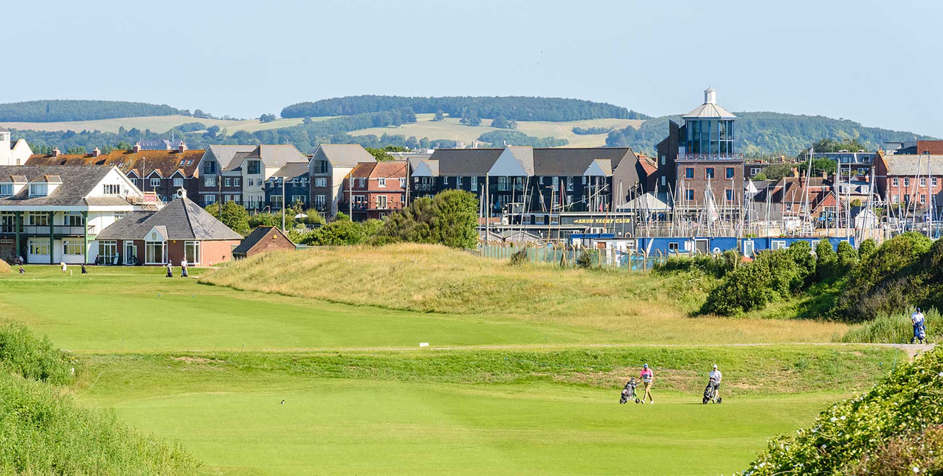 The golf course and Yacht club in the foreground of Littlehampton with the south downs set behind.