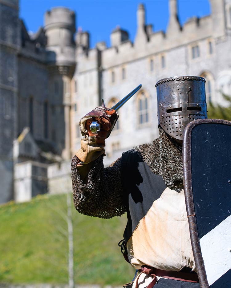A knight in full armour during a re-enactment eventin the grounds of Arundel Castle