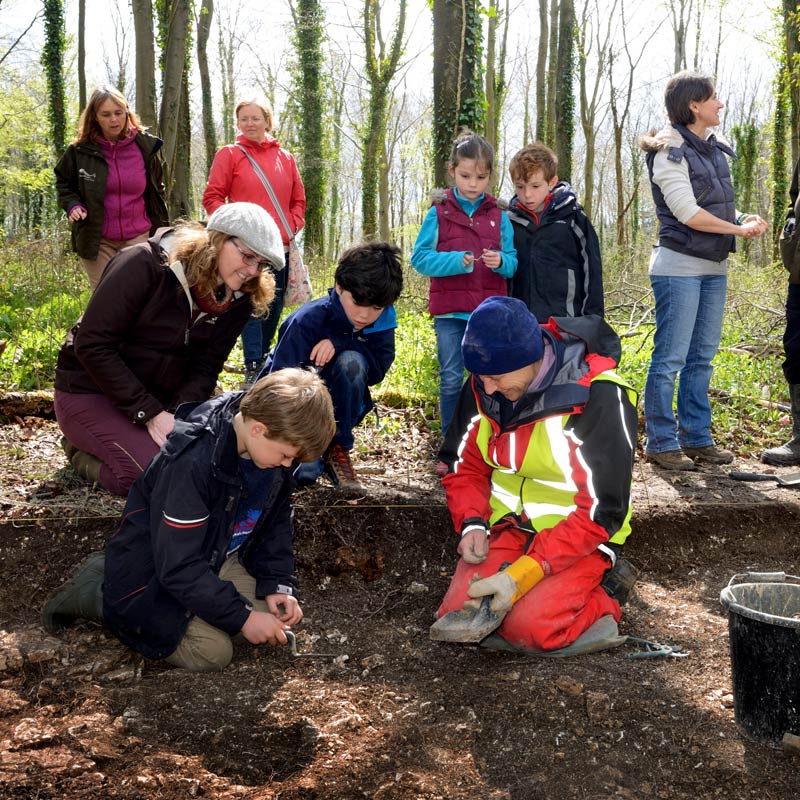 A group of adults and children enjoying one of many events organised by the National Park Rangers.