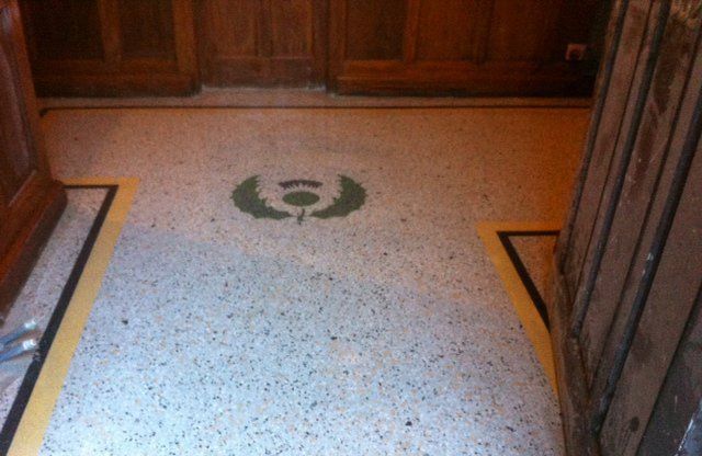 terrazzo flooring after with crest