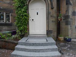 entrance door with terrazzo grey steps