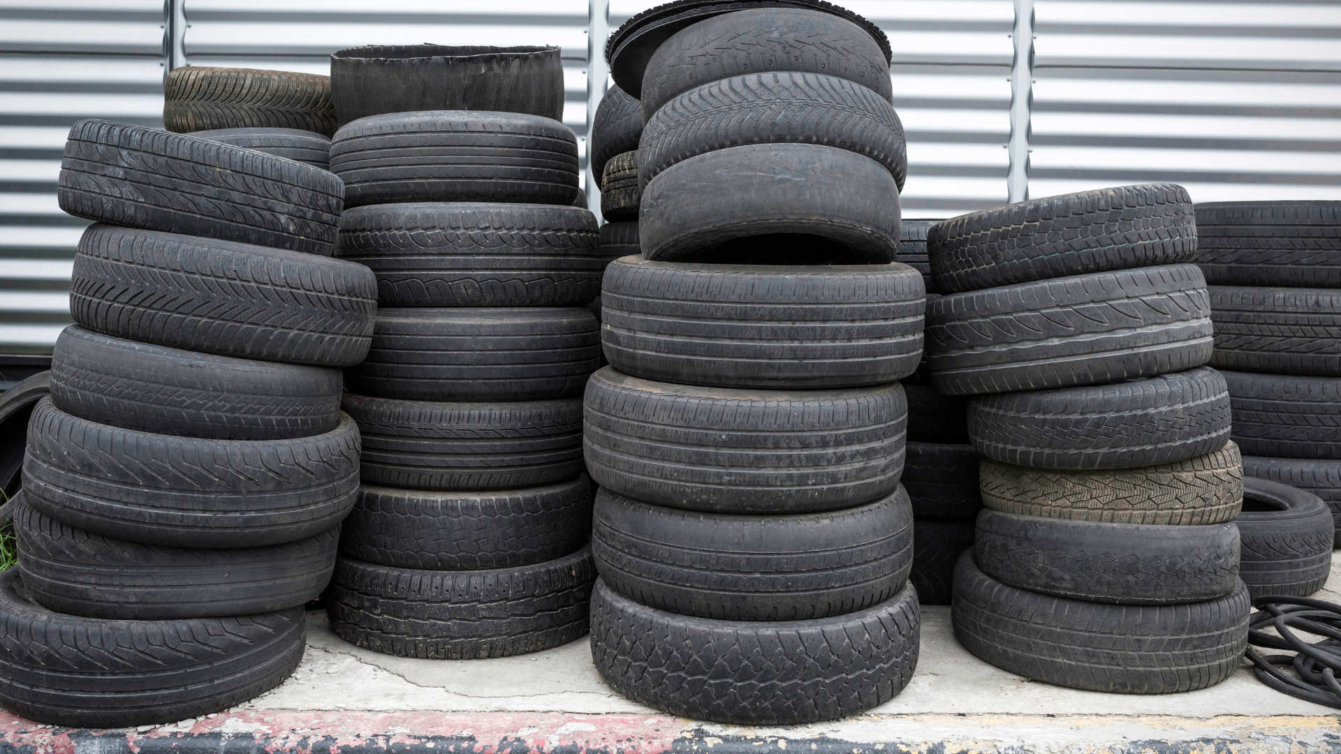 A pile of tires stacked on top of each other on a table.