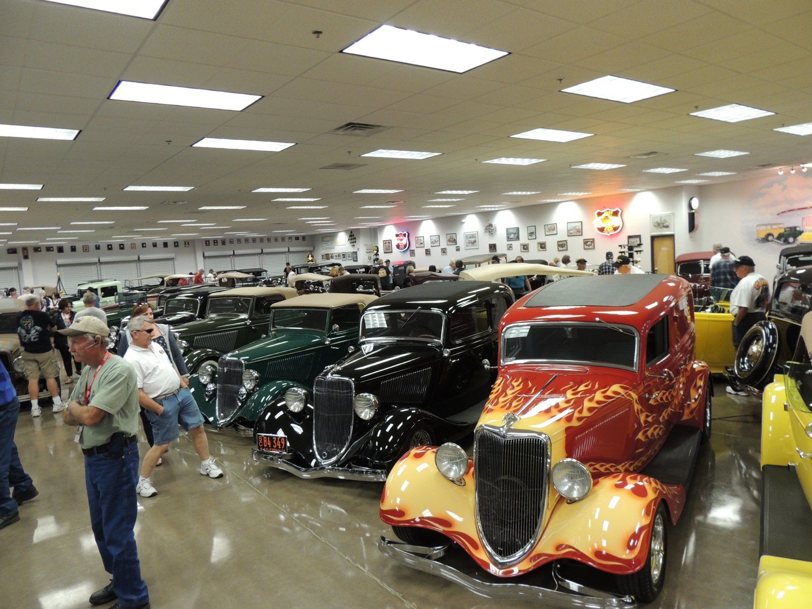 A large room filled with lots of old cars