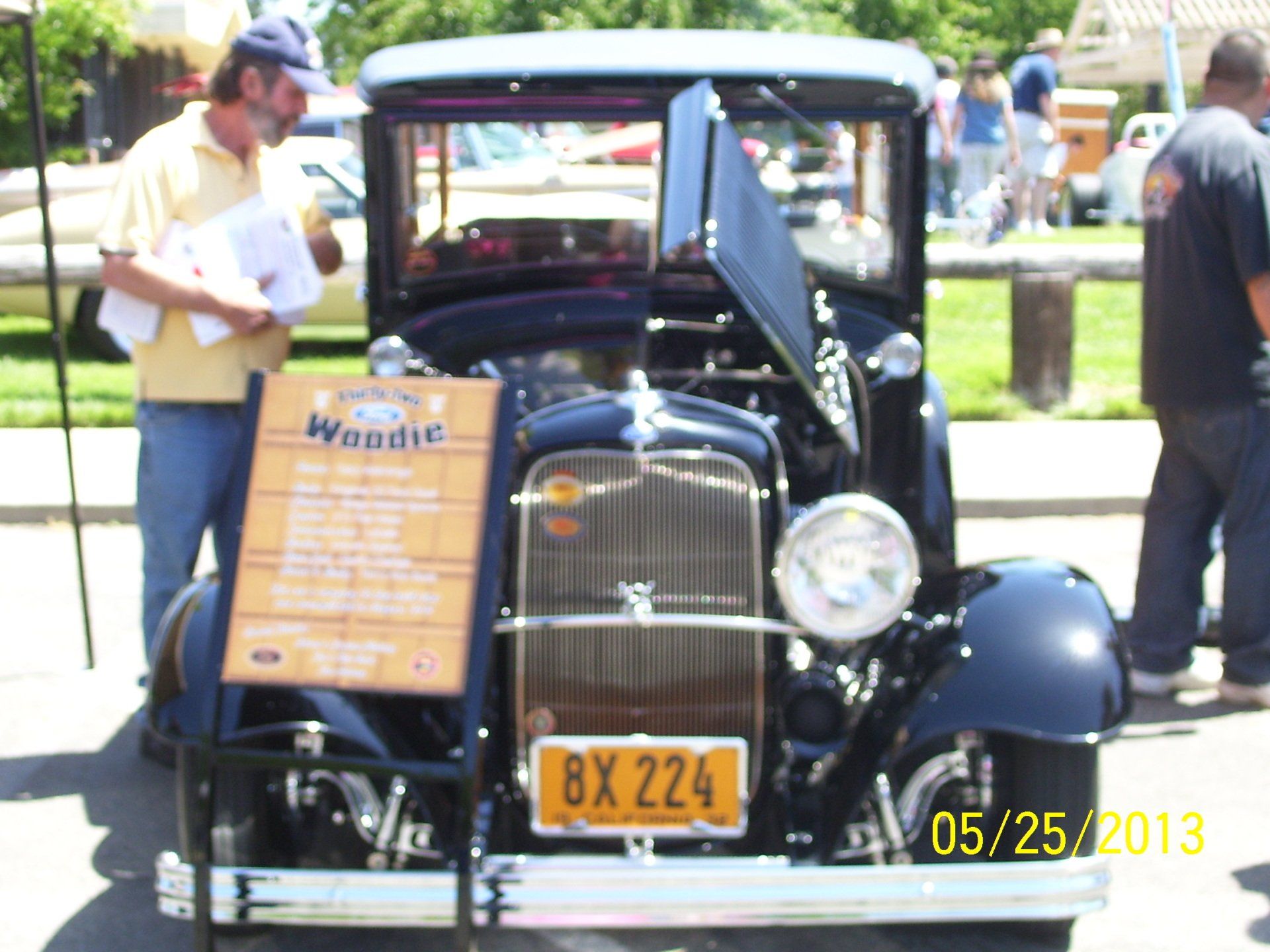 A black car with a license plate that says 8x 224