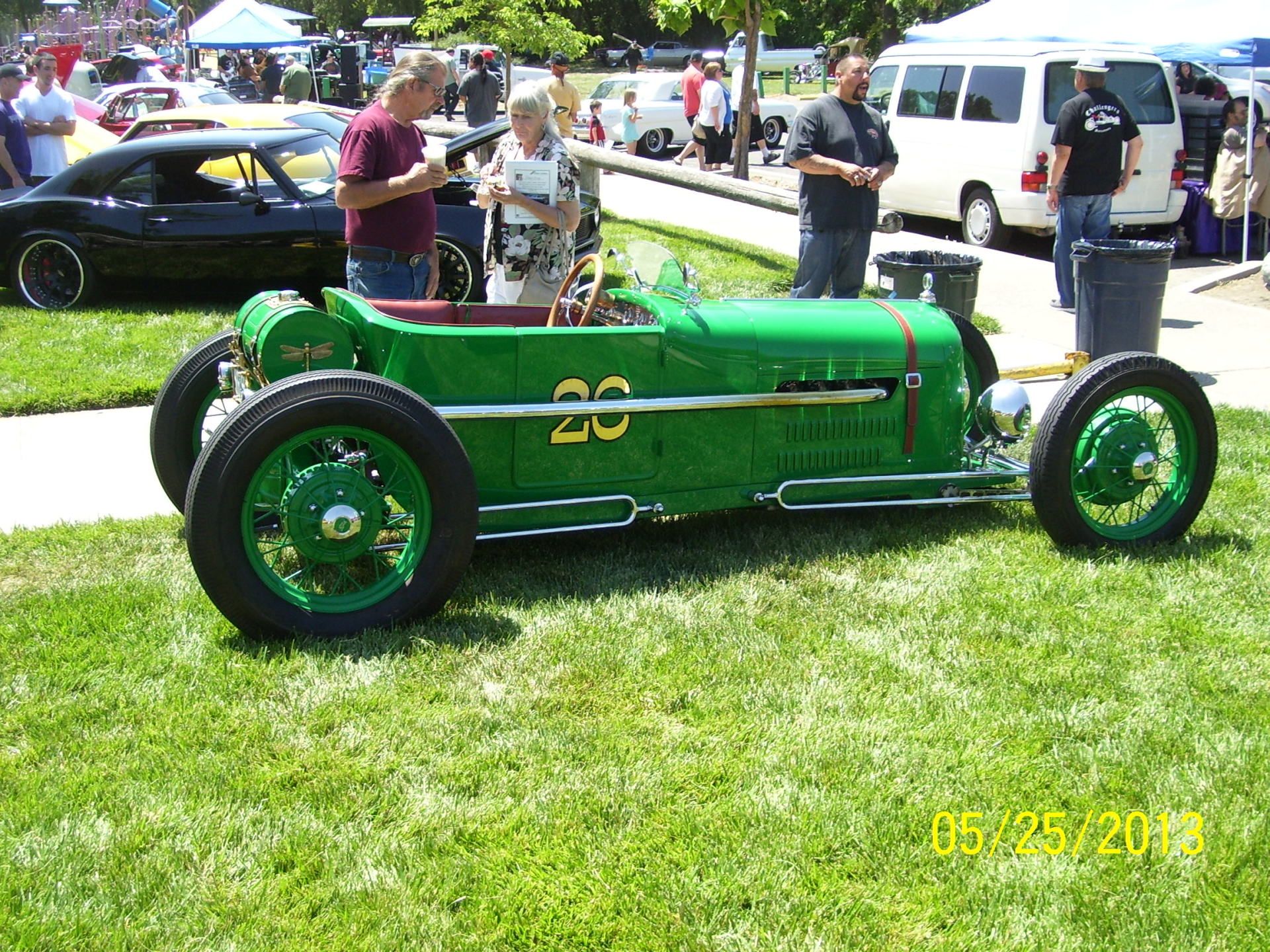 A green race car with the number 20 on it