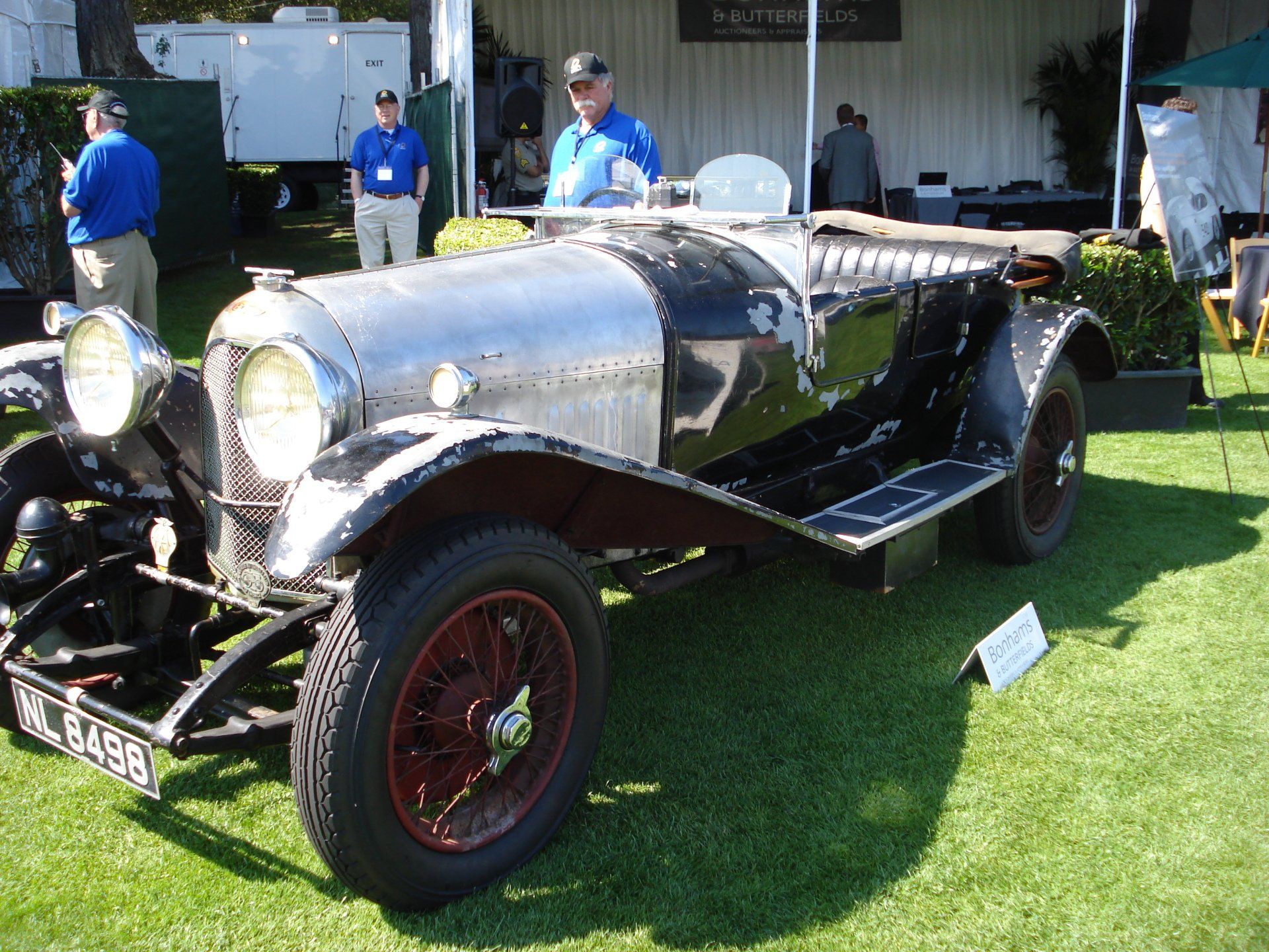 A black car with a license plate that says nc-5588