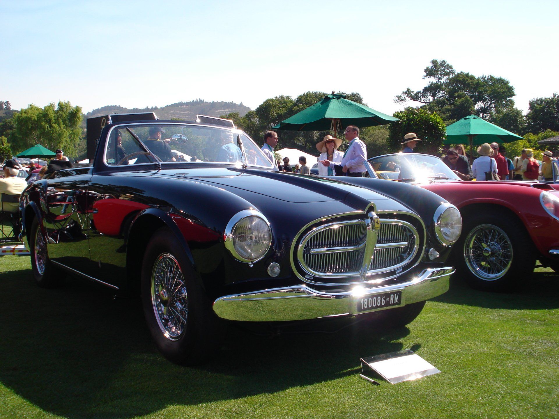 A black car with a license plate that says ' a ' on it