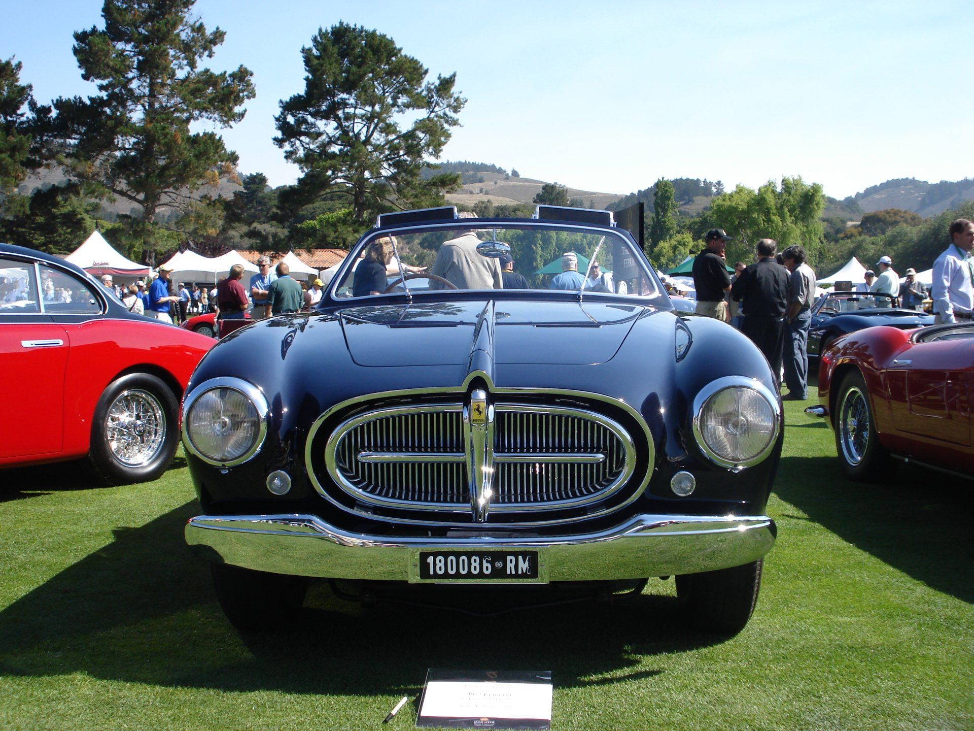 A black car with a license plate that says 193086-bp