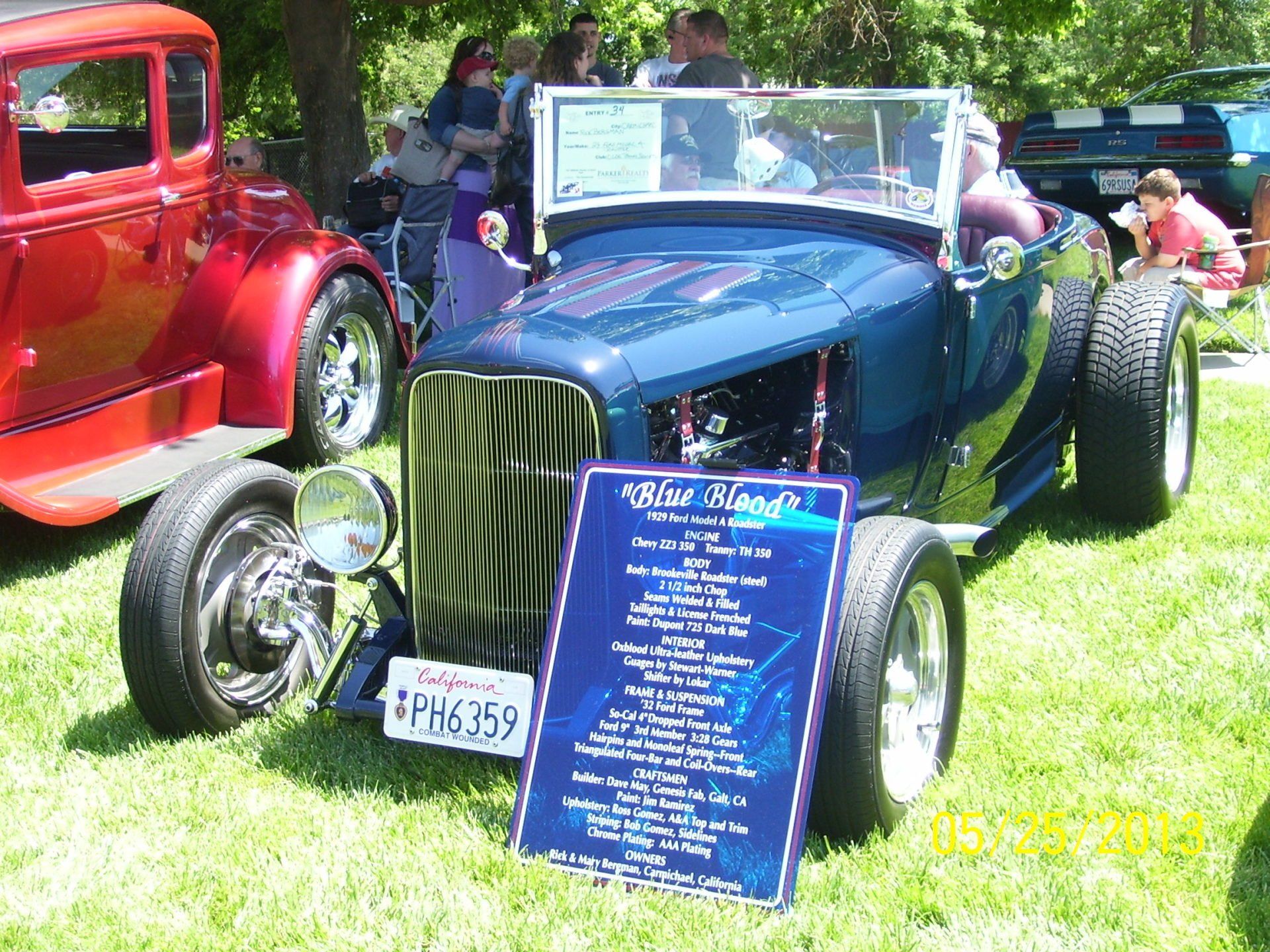 A blue car with a sign that says 