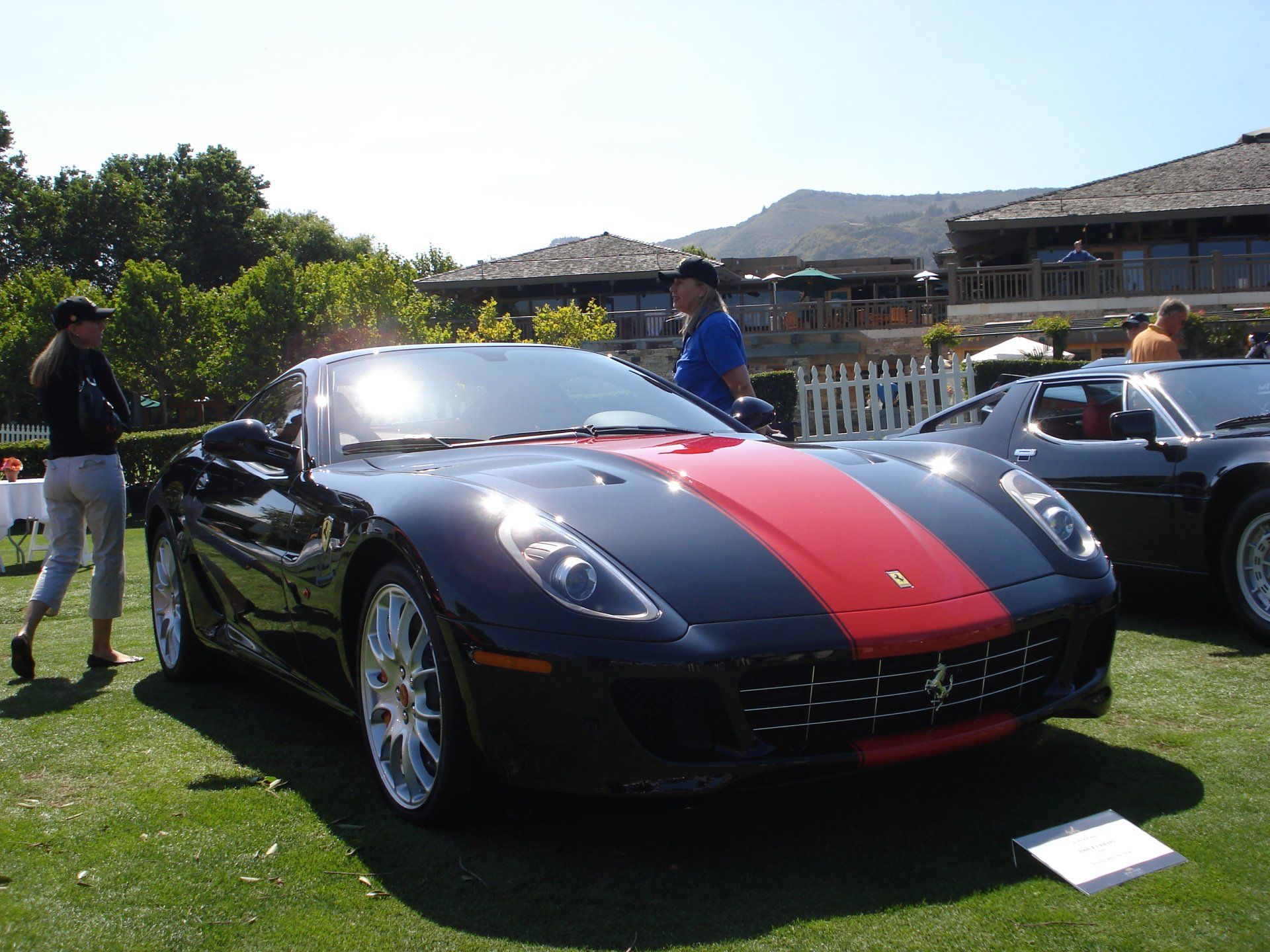 A black car with a red stripe on the side