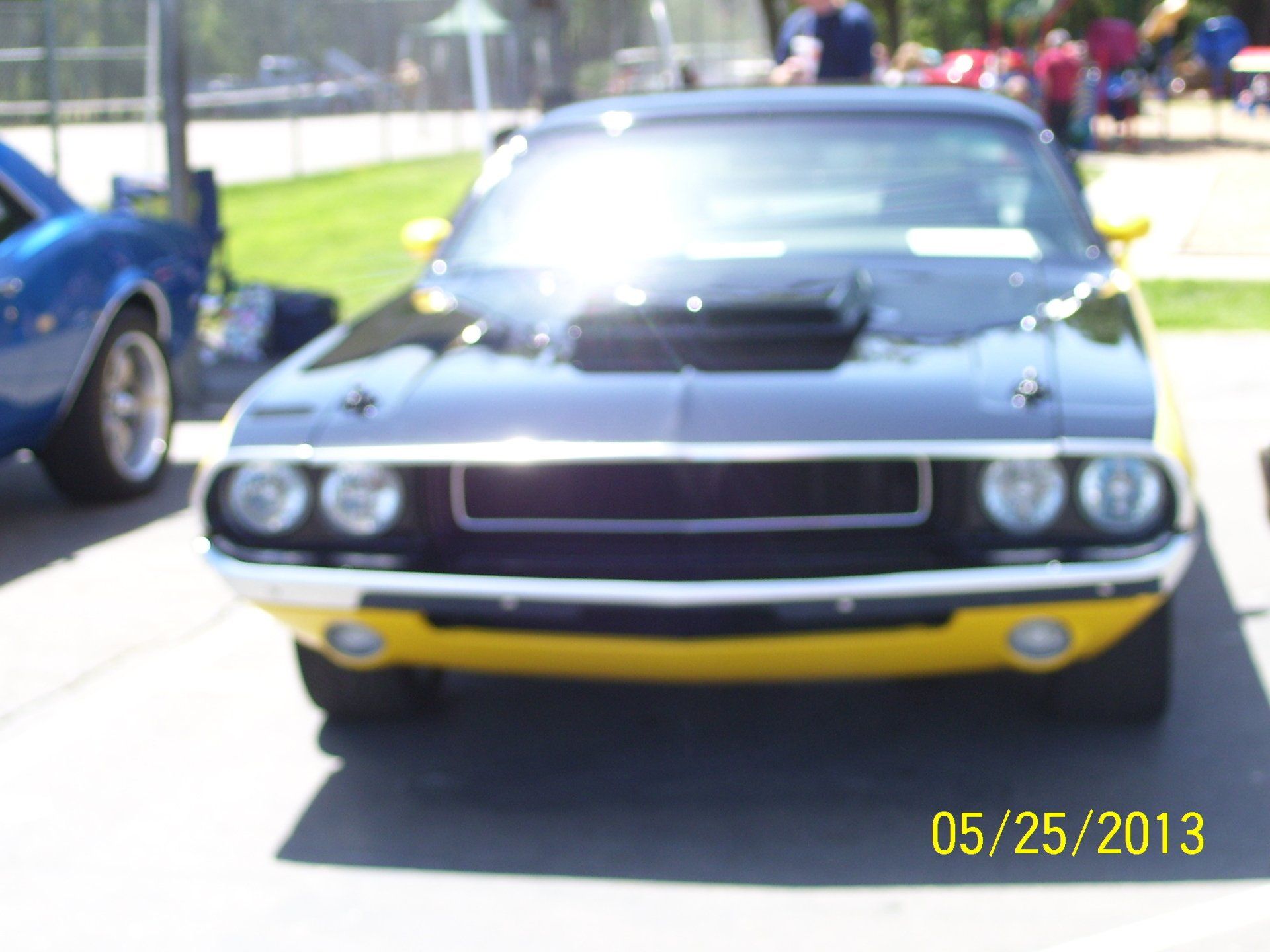 A picture of a black and yellow car taken on 05/25/2013