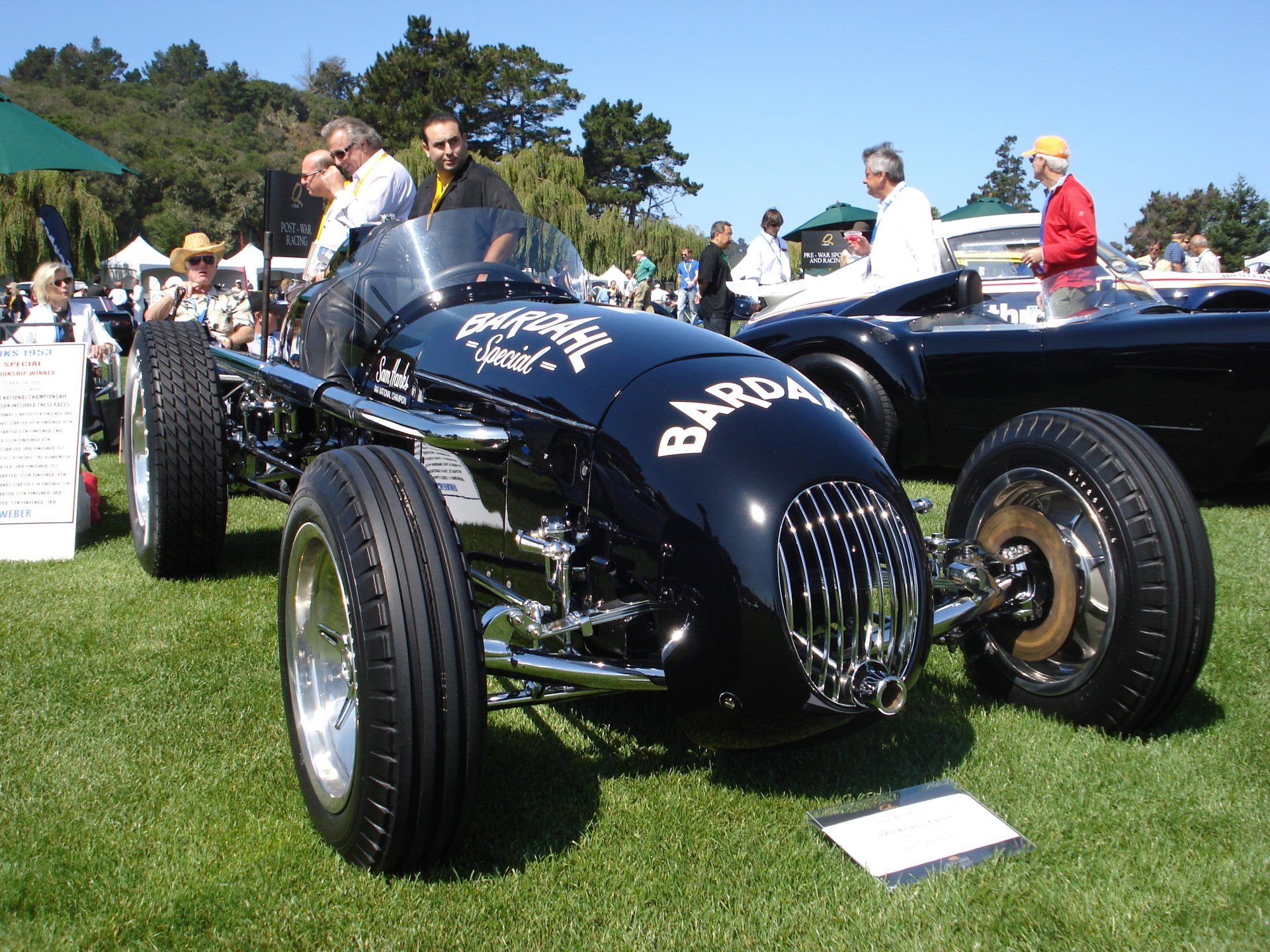 A black car with the word barda on the side