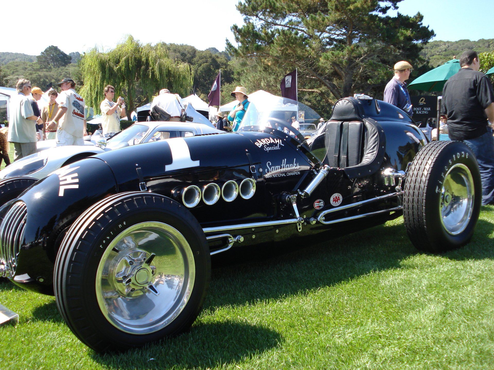 A black race car with the number 1 on the side