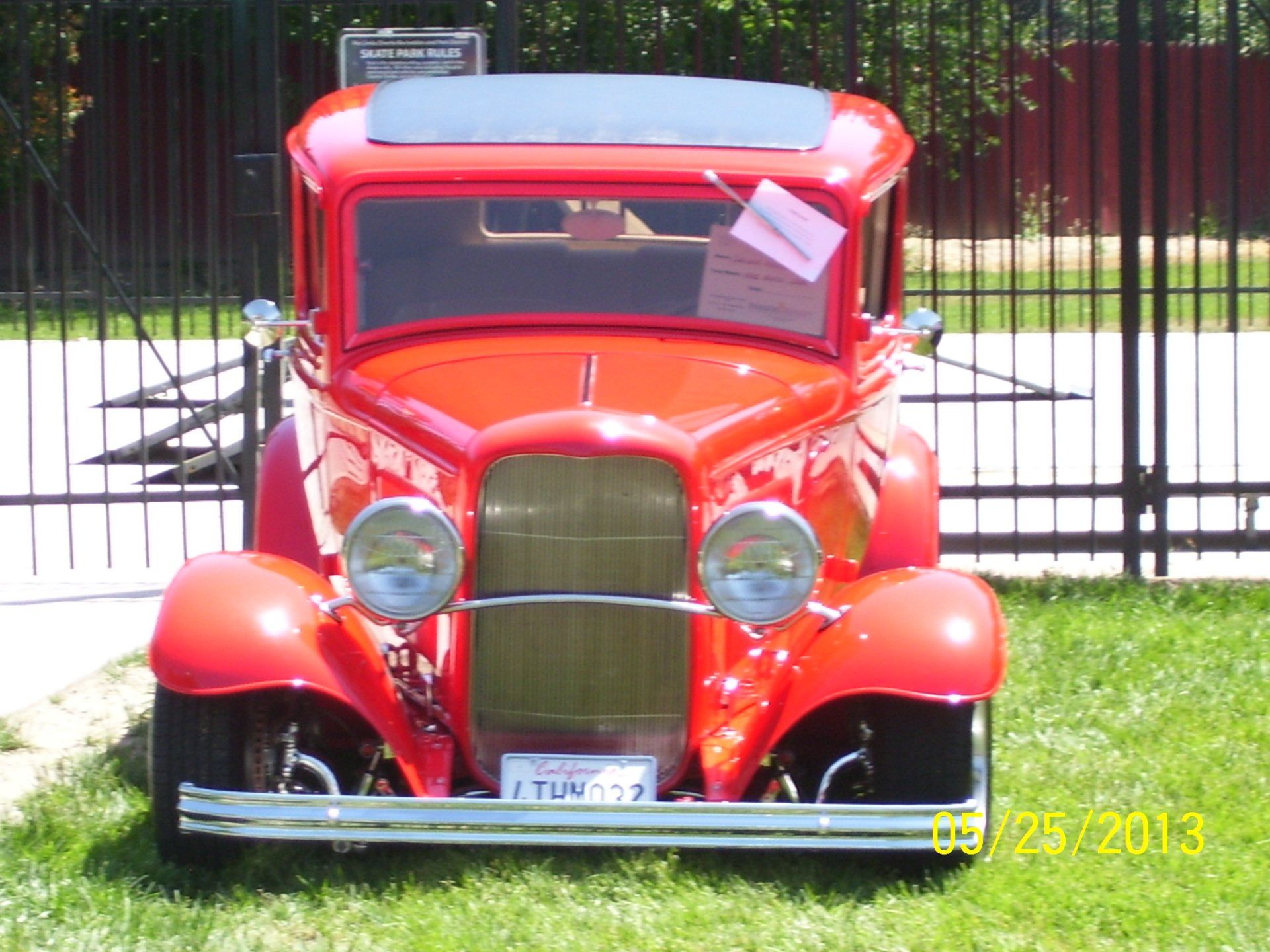 A red car with a license plate that says i tuw139