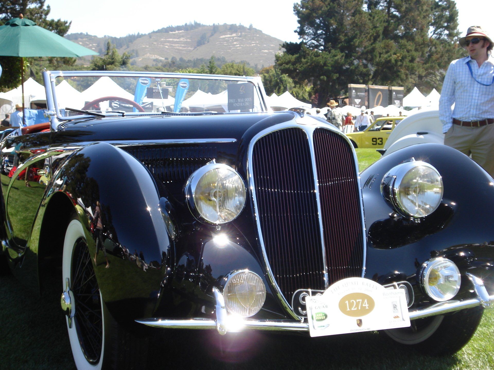 A black car with a license plate that says 1274